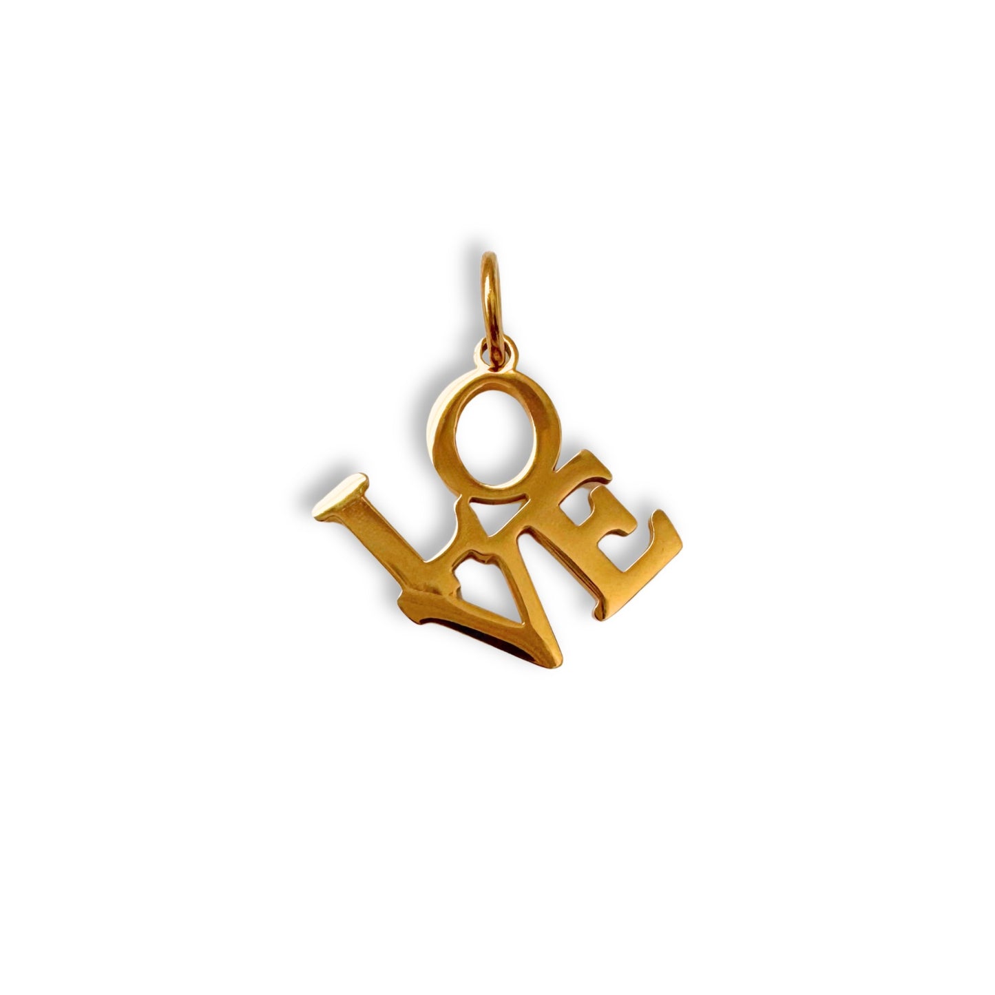 Gold 'LOVE' pendant on a white background