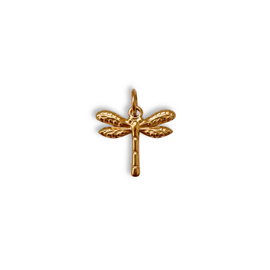 Gold dragonfly pendant on a white background