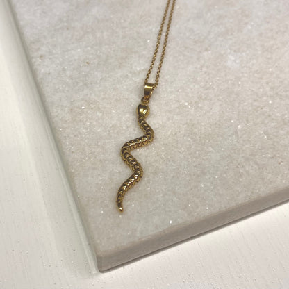 gold snake pendant on thin gold chain