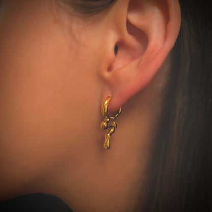 gold melting style hoops in ear