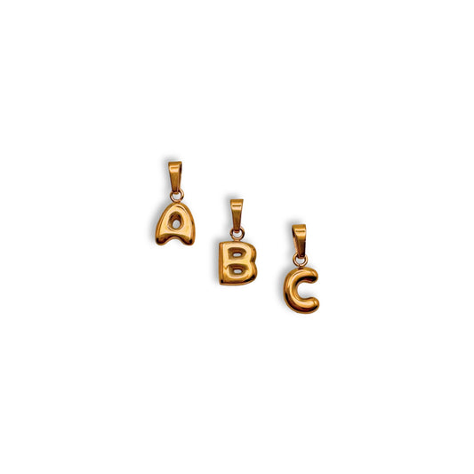 Three gold pendants with letters A, B, and C on a white background