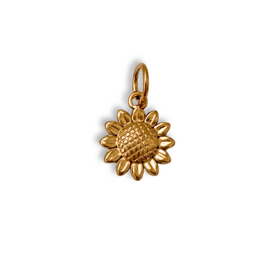 Gold sunflower pendant on a white background
