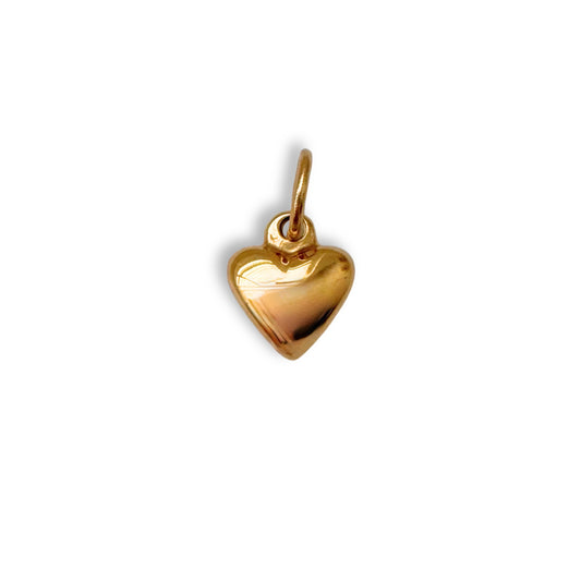 Gold heart-shaped pendant on a white background